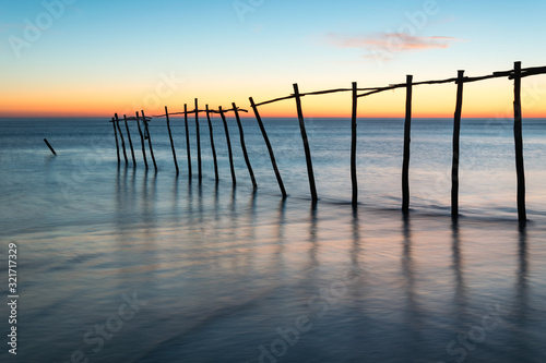 Magnificent long exposure sunset on the beach and sea.