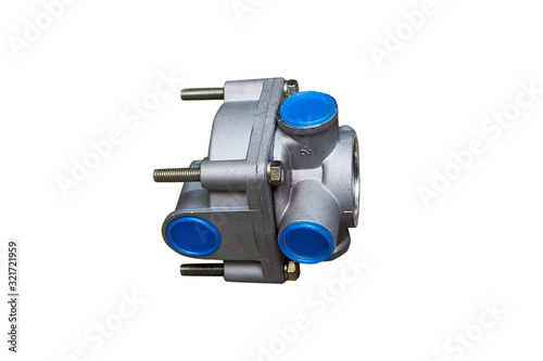The valve of the accelerator brake system of a truck on an isolated white background. Distributes compressed air flows between the elements of the pneumatic system.