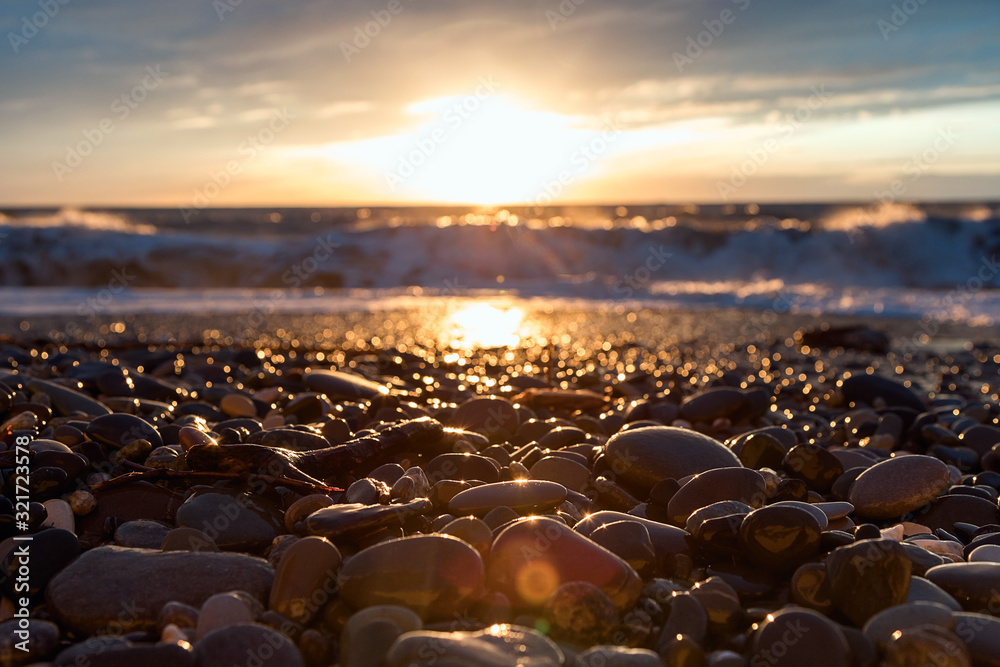Sea sunset. Waves roll on the shore. The violence of the elements. Sea foam. Sea sunset. Waves roll on the shore. The violence of the elements. Sea foam.