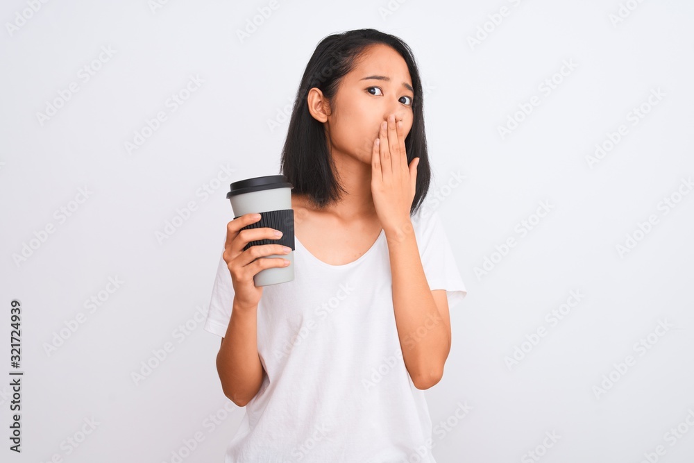 Young chinese woman drinking take away glass of coffee over isolated white background cover mouth with hand shocked with shame for mistake, expression of fear, scared in silence, secret concept Young chinese woman drinking take away glass of coffee over isolated white background cover mouth with hand shocked with shame for mistake, expression of fear, scared in silence, secret concept