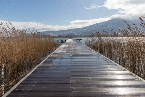 Fototapeta Naklejka Na Ścianę i Meble -  wooden walkway on sapanca lake in winter