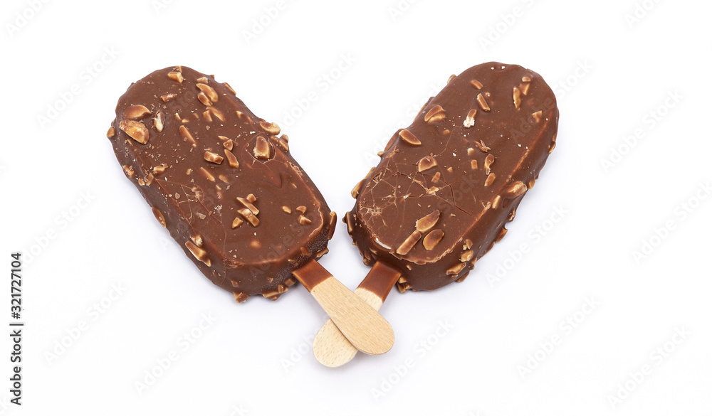 Chocolate ice cream with nuts on a stick. Isolated on a white background. Tasty dessert. Chocolate ice cream with nuts on a stick. Isolated on a white background. Tasty dessert.