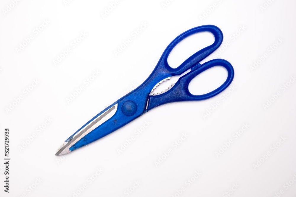 Blue kitchen scissors close up on white background Blue kitchen scissors close up on white background