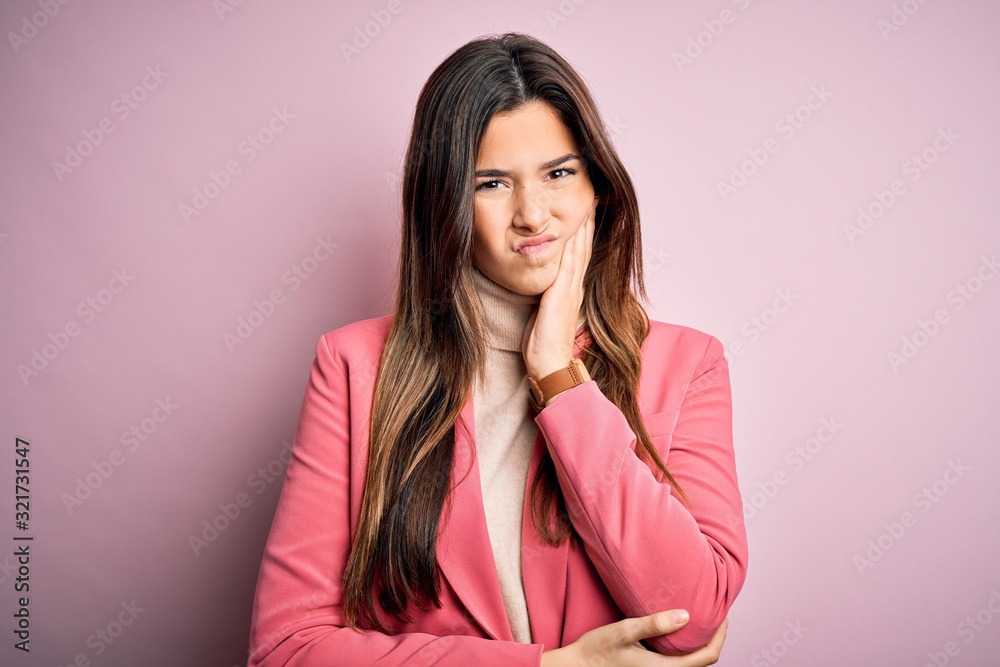 Young beautiful businesswoman wearing casual turtleneck sweater and jacket thinking looking tired and bored with depression problems with crossed arms. Young beautiful businesswoman wearing casual turtleneck sweater and jacket thinking looking tired and bored with depression problems with crossed arms.