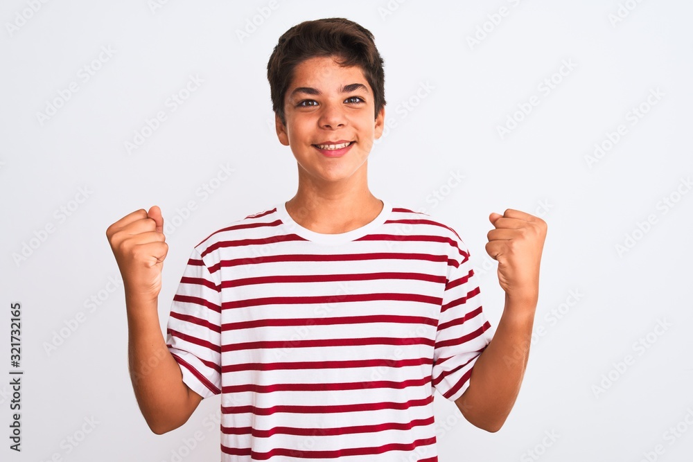 Handsome teenager boy standing over white isolated background celebrating surprised and amazed for success with arms raised and open eyes. Winner concept. Handsome teenager boy standing over white isolated background celebrating surprised and amazed for success with arms raised and open eyes. Winner concept.