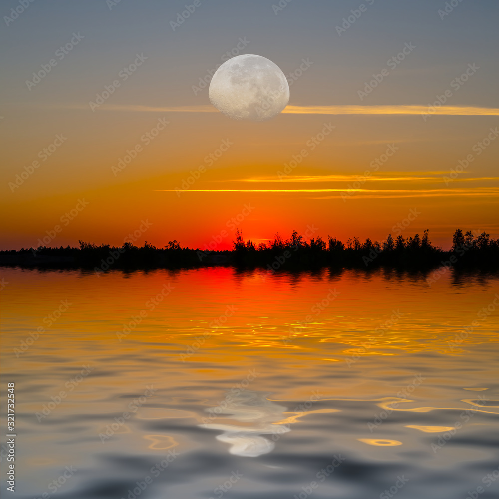 huge half moon and red dramatic sunset over the lake huge half moon and red dramatic sunset over the lake