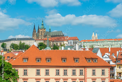 Top view to red roofs and blue sky skyline of Prague city Czech republic.