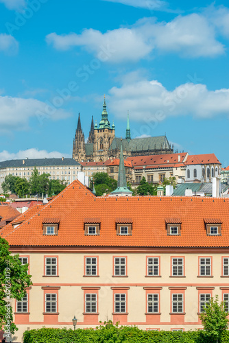 Top view to red roofs and blue sky skyline of Prague city Czech republic.