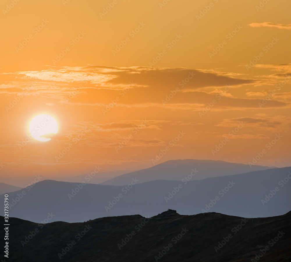 beautiful mountain ridge silhouette at the sunset, natural background