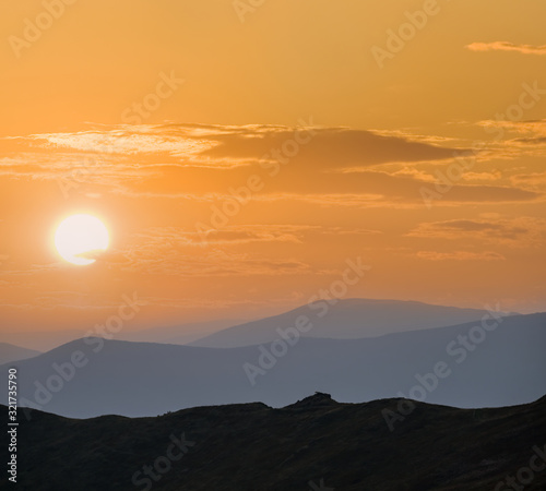 beautiful mountain ridge silhouette at the sunset, natural background