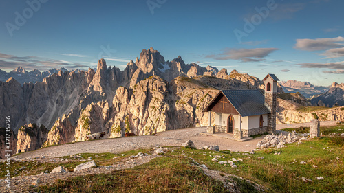 Mountain trail to Tre Cime and small chapel in Dolomites