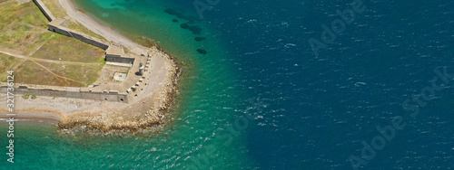 Aerial drone ultra wide photo of famous castle of Rio next to famous cable bridge of Harilaos Trikoupis, Greece photo