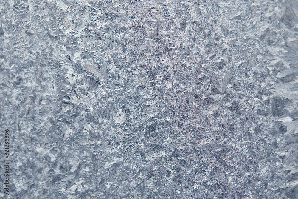 Fototapeta premium Frozen drops of condensed steam water drops on the transparent window glass. Clean background. Condensation of moisture at extreme temperatures. Water vapor condenses on cold window glass and freezes