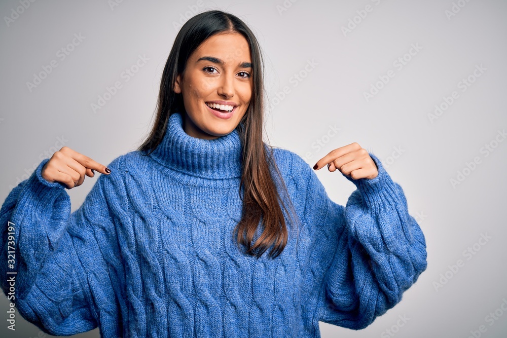 Young beautiful brunette woman wearing casual turtleneck sweater over white background looking confident with smile on face, pointing oneself with fingers proud and happy. Young beautiful brunette woman wearing casual turtleneck sweater over white background looking confident with smile on face, pointing oneself with fingers proud and happy.