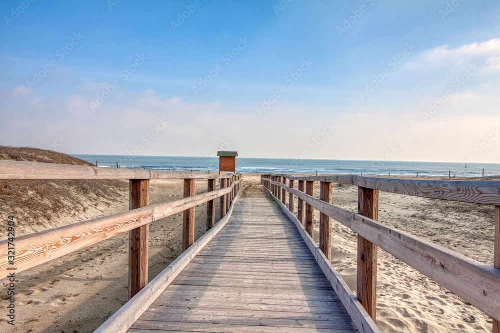 Arrival path to the beach in a sunny day Arrival path to the beach in a sunny day