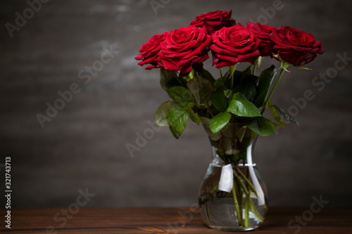 Red roses bunch on the moody background