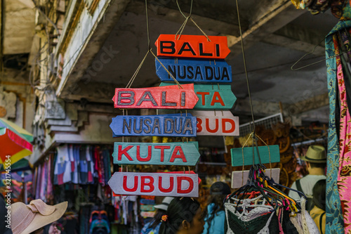 Regional signboards are sold as souvenirs in the Ubud traditional market.