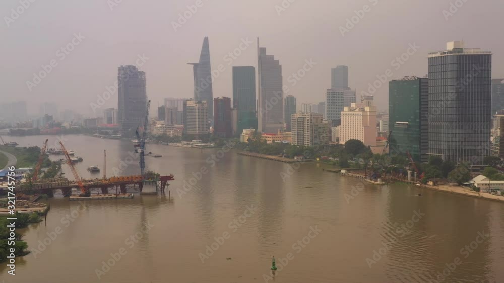 Aerial Vietnam Ho Chi Minh City Waterfront Downtown September 2019 Hazy Overcast Day 4K Mavic Pro Aerial video of downtown Ho Chi Minh City in Vietnam on a cloudy hazy overcast day. Aerial Vietnam Ho Chi Minh City Waterfront Downtown September 2019 Hazy Overcast Day 4K Mavic Pro Aerial video of downtown Ho Chi Minh City in Vietnam on a cloudy hazy overcast day.