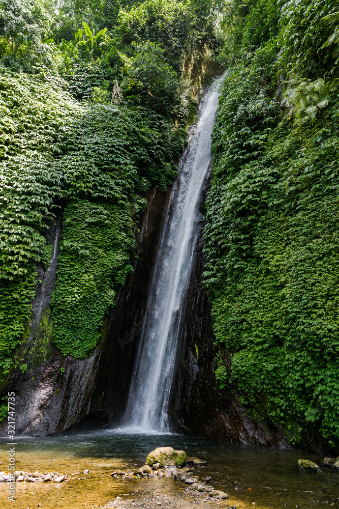 Straight waterfalls cut through the rocks and water the scrub that thrives. Straight waterfalls cut through the rocks and water the scrub that thrives.