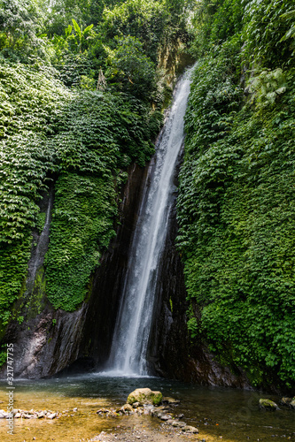 Straight waterfalls cut through the rocks and water the scrub that thrives.