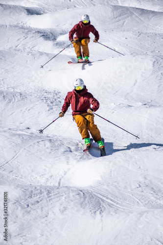 People are enjoying mogul skiing snow boarding 