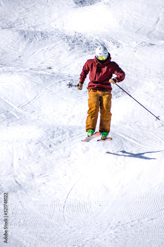 People are enjoying mogul skiing snow boarding 