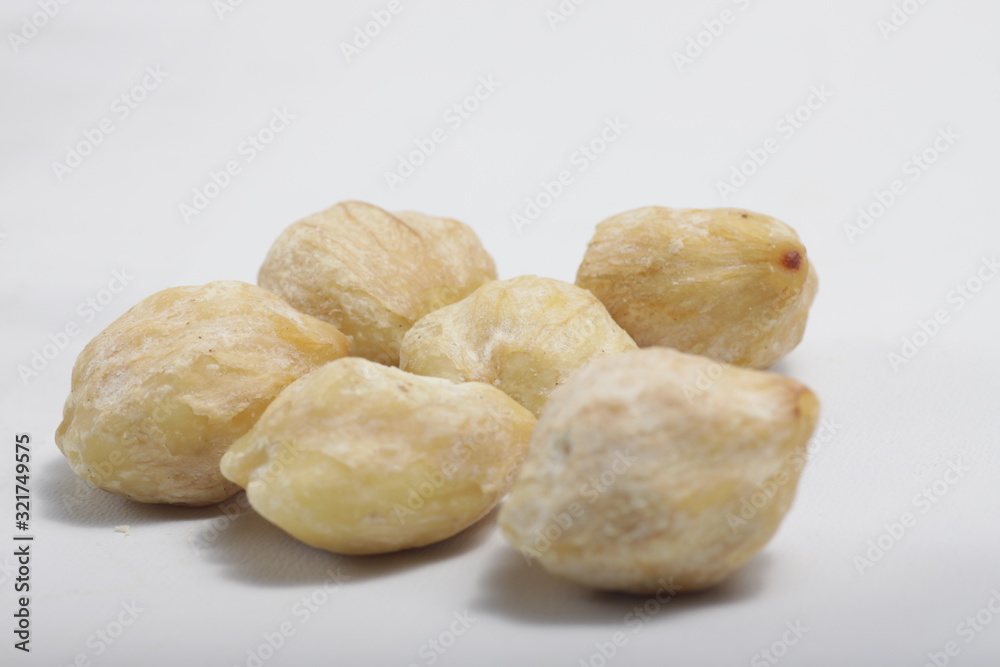 candlenut also known as kemiri at Indonesia, one of herbs that usually used for asian food as seasoning candlenut also known as kemiri at Indonesia, one of herbs that usually used for asian food as seasoning