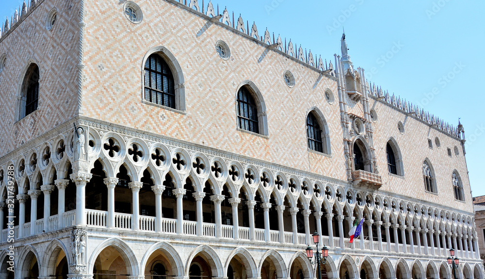 View on Doge's Palace (Palazzo Ducale) and pink street lamp  on Piazza San Marco, Saint Mark's Square, Venice, Italy
