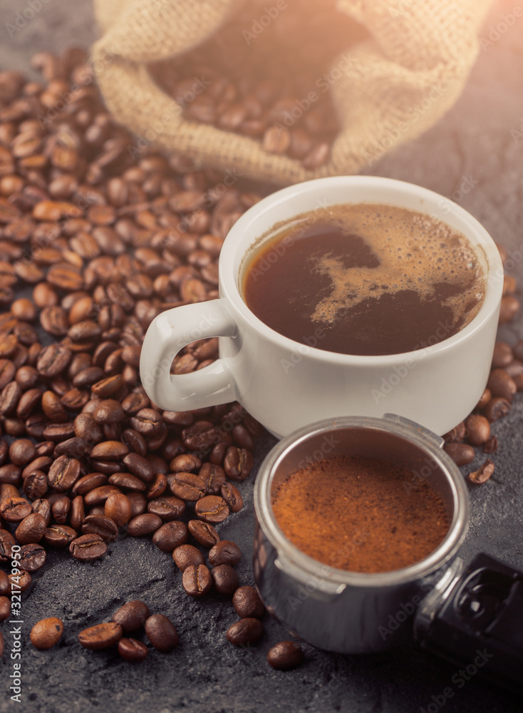Ground coffee and coffee beans on old cafe table. Ground coffee and coffee beans on old cafe table.