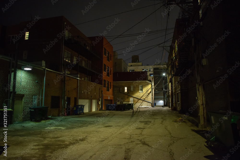 Dark and eerie urban city alley at night 