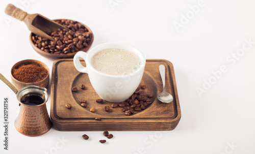 Ground coffee and coffee beans on white background photo