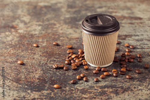 Ground coffee and coffee beans on old cafe table.
