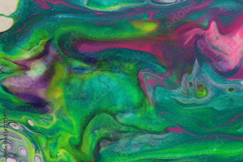 Pink and green swirl and move across the canvas in this abstract backgound.
