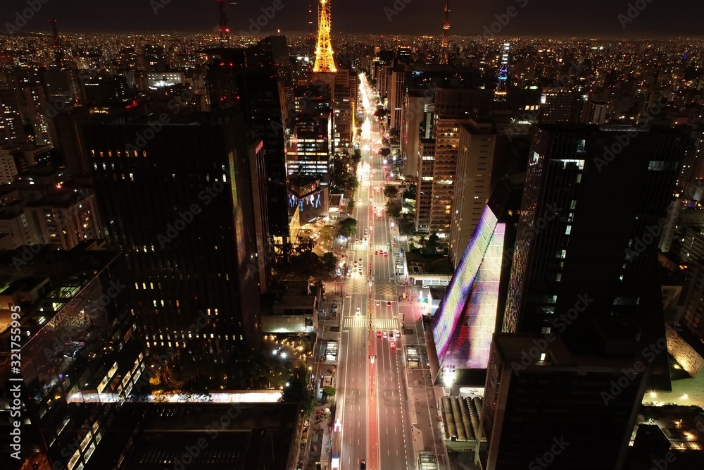Panoramic view of a illuminated avenue em São Paulo, Brazil. Paulista Avenue. Great landscape. Colorful scenery.