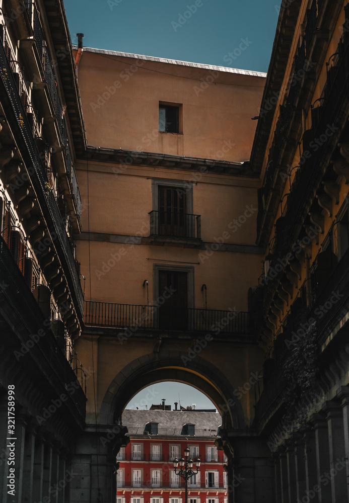 Fototapeta premium Nice view of the entrance to Plaza Mayor in the city of Madrid ,Spain with the typicall balconies and windows on facade buildings