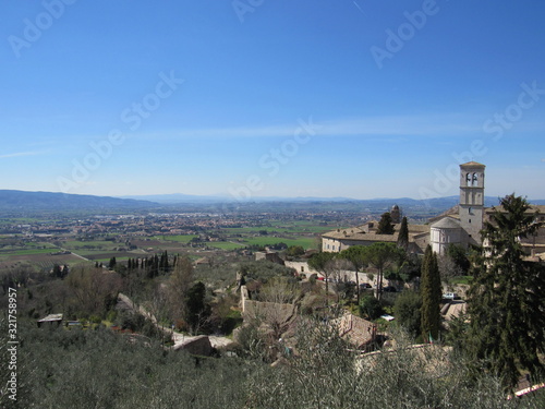 View of the landscape from Piazza Santa Chiara in Assisi, Italy with the church of Saint Mary Maggiore in view