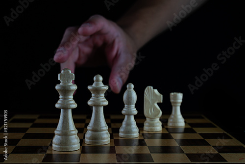 chess pieces on black background photo