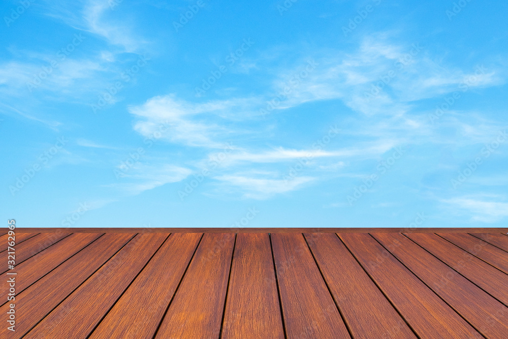 wooden table top with the blue sky landscape