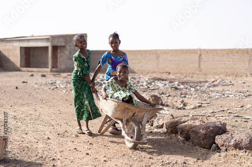  Candid photo of Native African Juvenile Gathering fresh Water for a dehydration concept photo