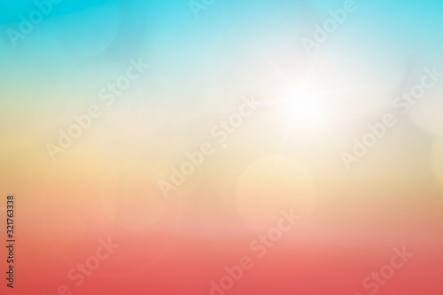 Fototapeta Naklejka Na Ścianę i Meble -  Natural background blurring warm colors and bright sun light. Bokeh or Christmas background Green Energy at sky sunny color orange light patterns plain abstract flare evening clouds blur.