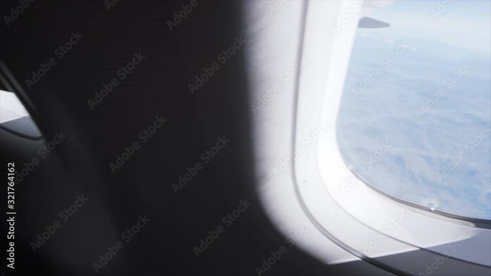 POV Window Airplane View and Closing window for transition, Above the Alps. (Slow Motion) POV Window Airplane View and Closing window for transition, Above the Alps. (Slow Motion)