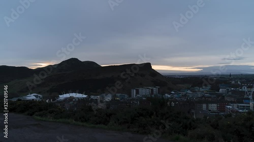 4K. Time lapse of a sunrise at Arthur's seat in Edinburgh, Scotland, United Kingdom. photo