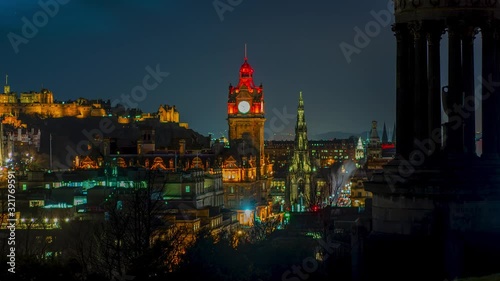4k. Epic time lapse of Edinburgh, during night, with beautiful colourful lights of the city. photo