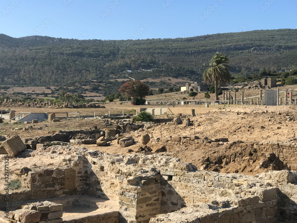 Old Roman theater or city in Tarifa beach area Andalucia Spain. You can see the remains of the building and stone bricks. This is entrance gate to the city.