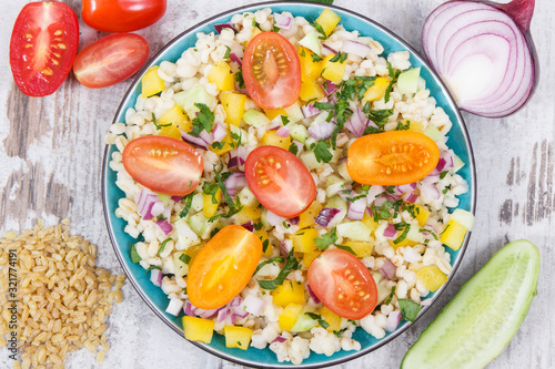 Salad with bulgur groats and vegetables as best food for dieting and slimming