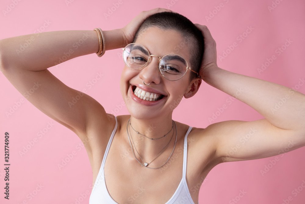 Happy young lady clutching her head stock photo