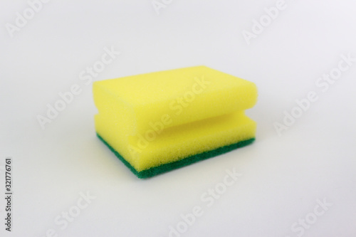 Yellow green kitchen sponge isolated on white background