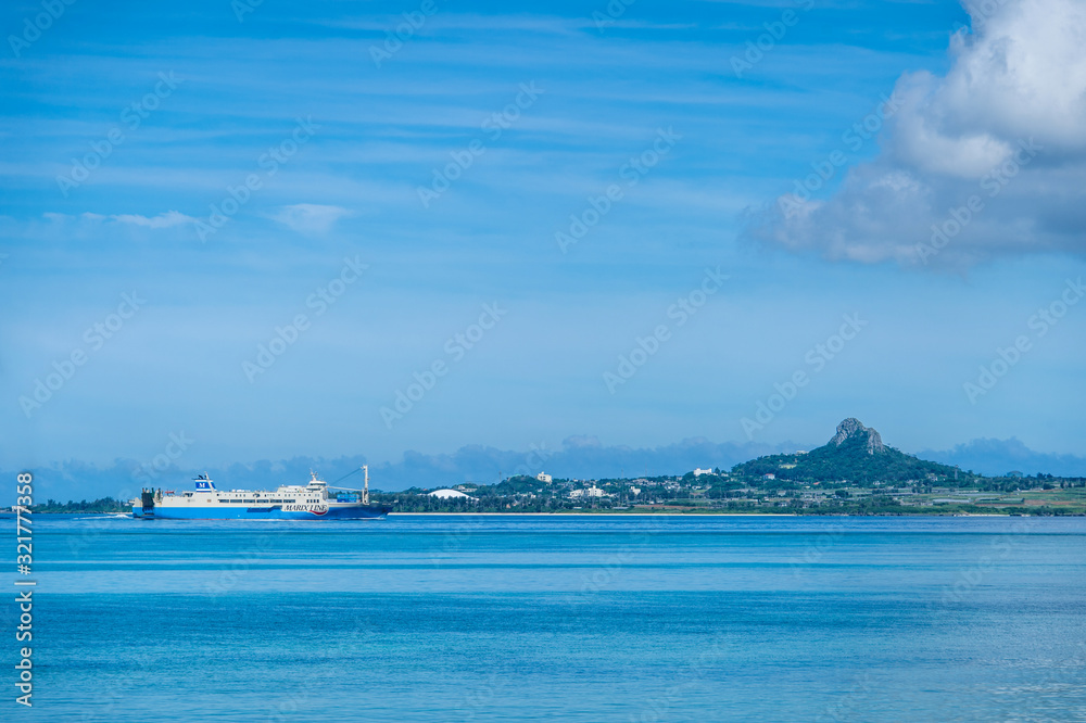 備瀬海岸から望む伊江島とフェリー -Okinawa blue sea-