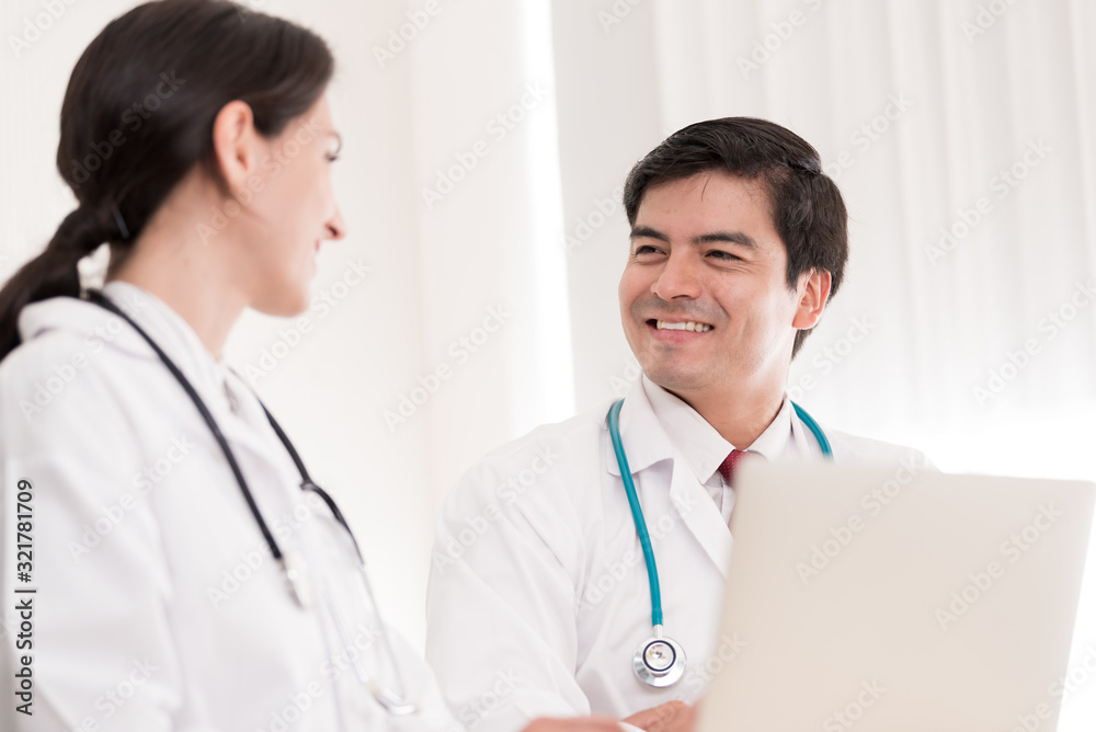 Two doctors have working together with happiness in the hospital. Two doctors have working together with happiness in the hospital.