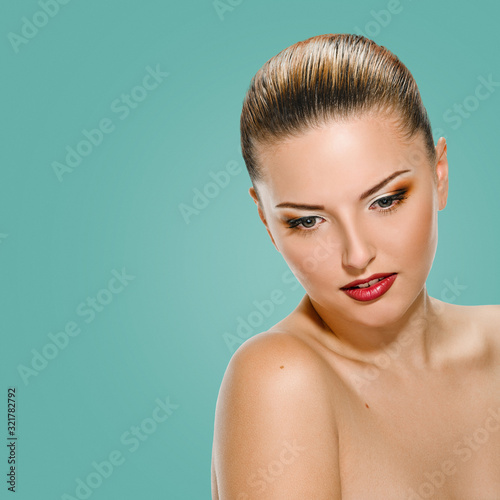 Beauty Girl. Portrait of Beautiful Young Woman looking down. Isolated on background jungle shade green color. Fresh Clean Skin